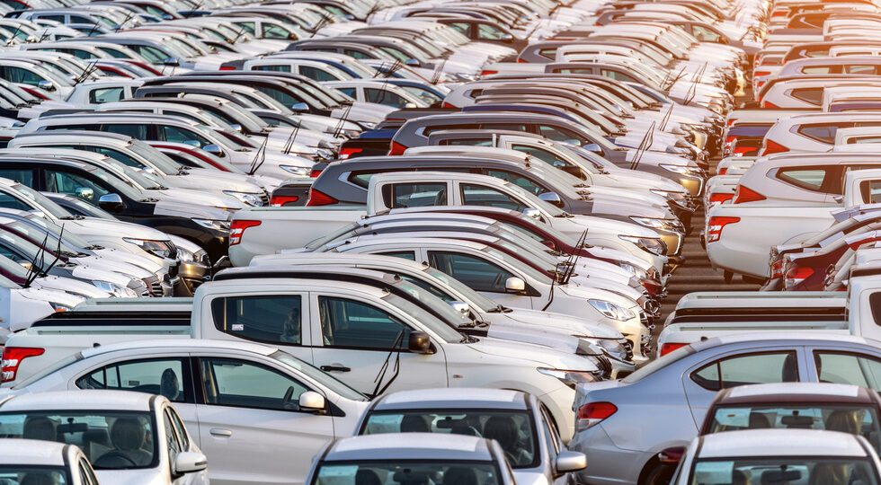 Row of new cars in port.